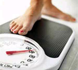 الزيادة في الوزن قد تسبب الشعور بالصداع 
