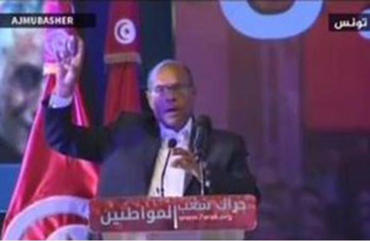المرزوقي يرفع شارة رابعة ويطالب بالإفراج عن مرسي