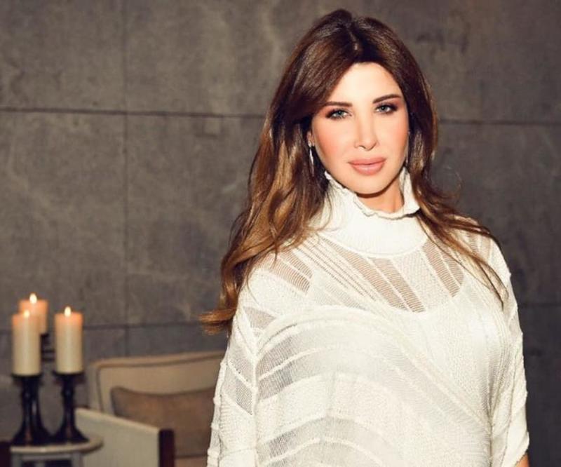 نانسي عجرم تشارك بتحدي الـ 10 سنوات على طريقتها ..  صورة